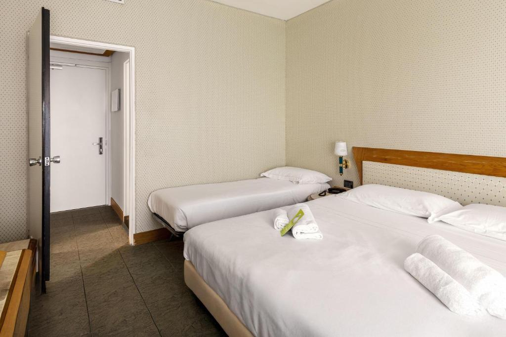 Postel nebo postele na pokoji v ubytování B&B Hotel Chioggia Airone