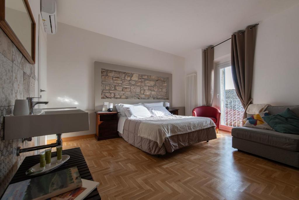Postel nebo postele na pokoji v ubytování My Home Assisi
