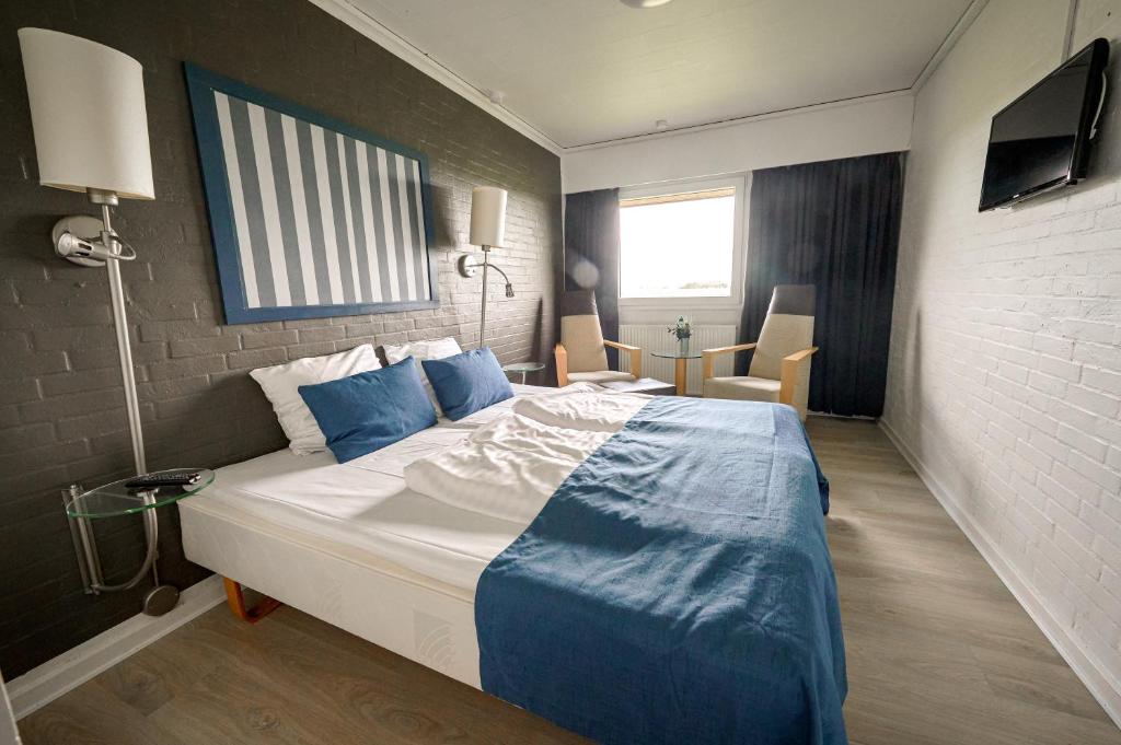 Postel nebo postele na pokoji v ubytování Hotel Fanø