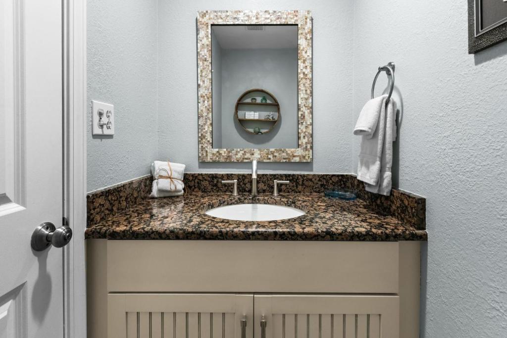 a bathroom with a sink and a mirror at Silver Sands Townhomes Unit 4 in Inlet Beach