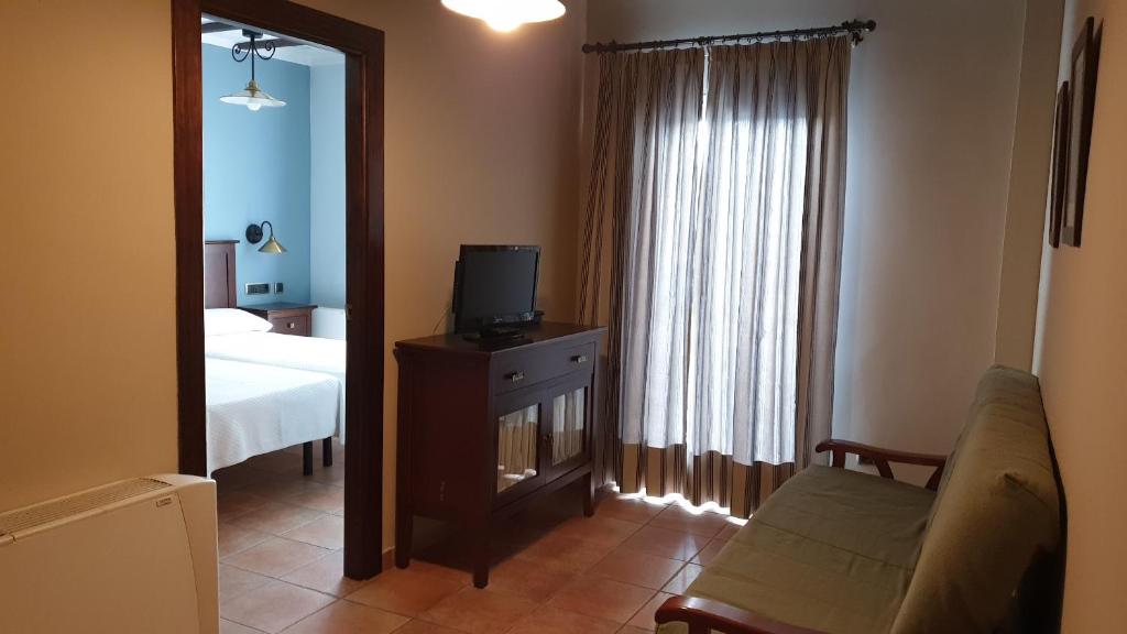 TV a/nebo společenská místnost v ubytování Hotel Tharsis