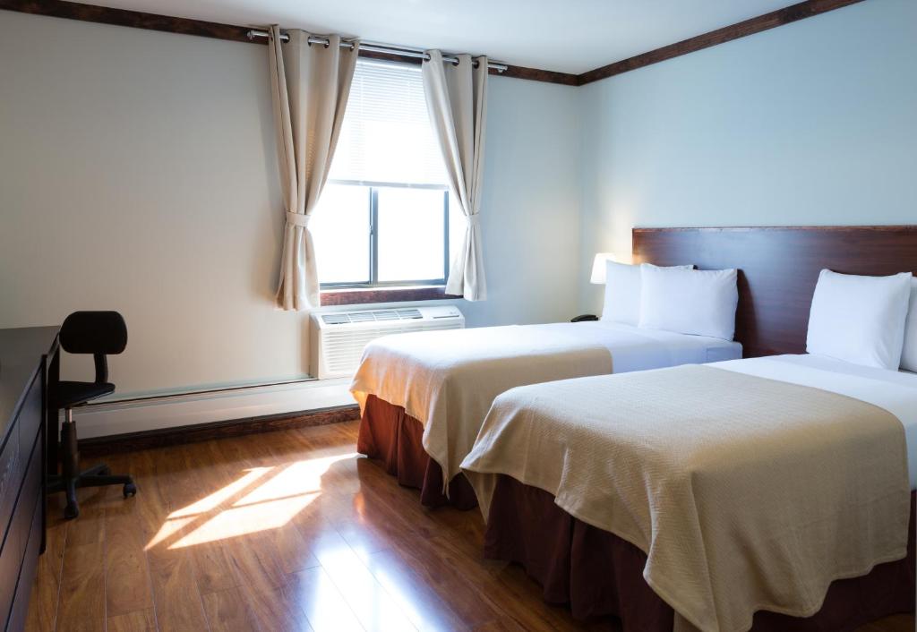 Postel nebo postele na pokoji v ubytování LIC Hotel