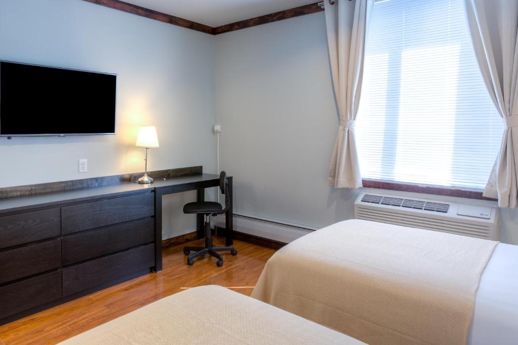 Postel nebo postele na pokoji v ubytování LIC Hotel