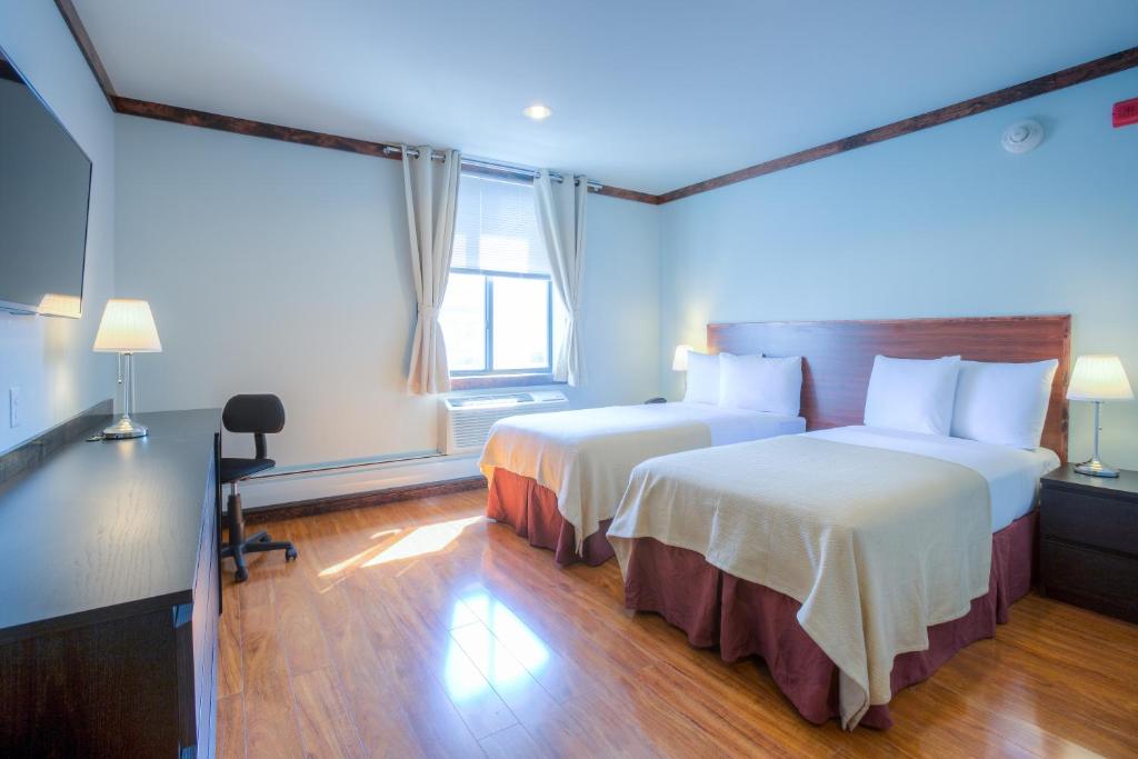Postel nebo postele na pokoji v ubytování LIC Hotel