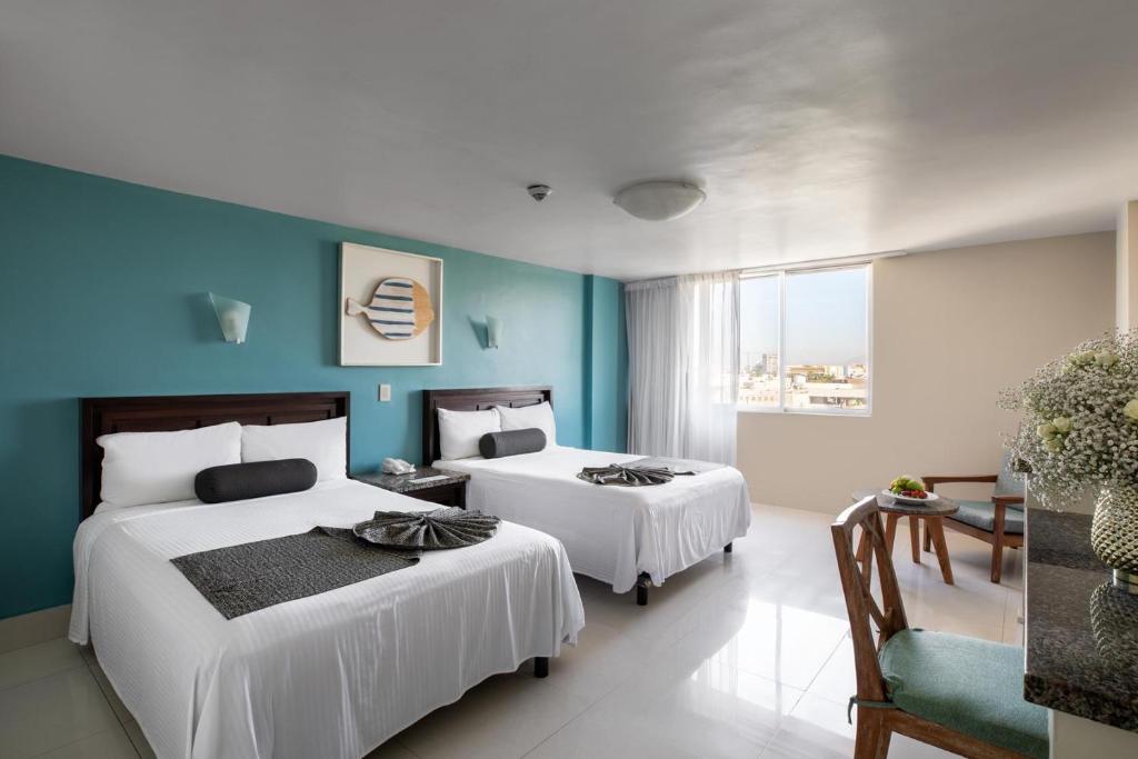 Cama o camas de una habitación en Don Pelayo Pacific Beach