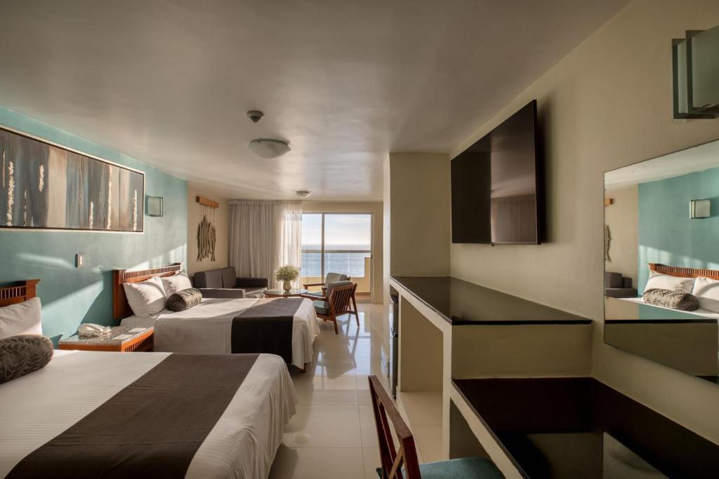 Cama o camas de una habitación en Don Pelayo Pacific Beach