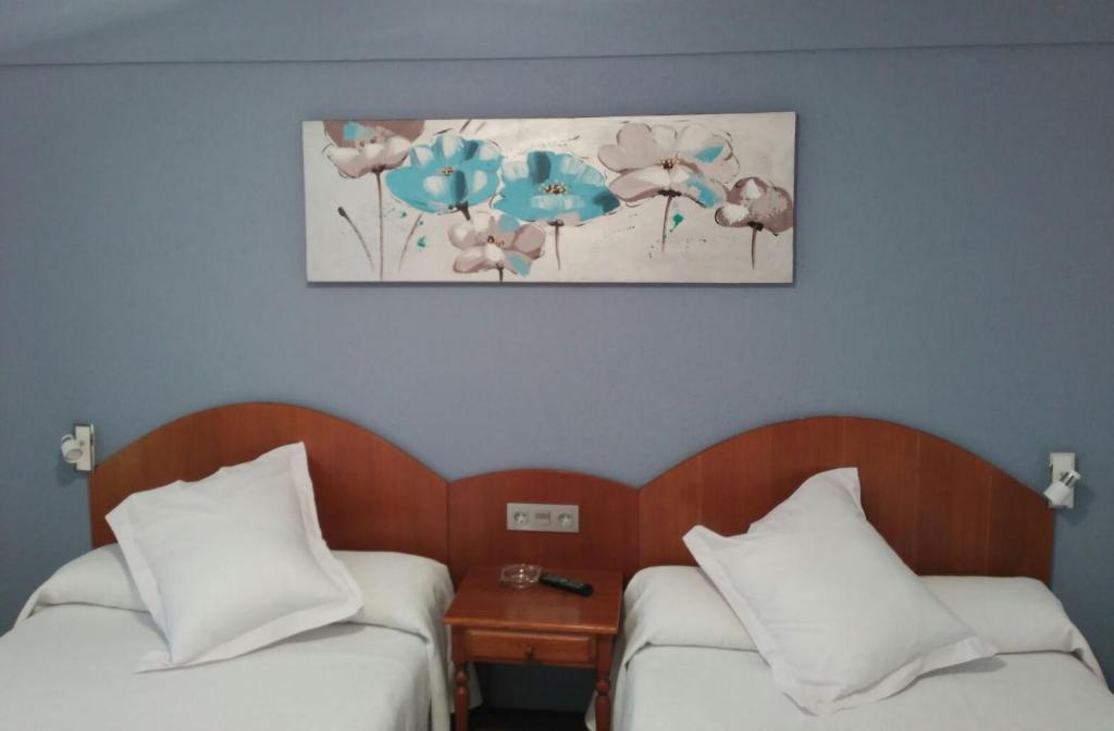 Postel nebo postele na pokoji v ubytování Hotel Urgaín