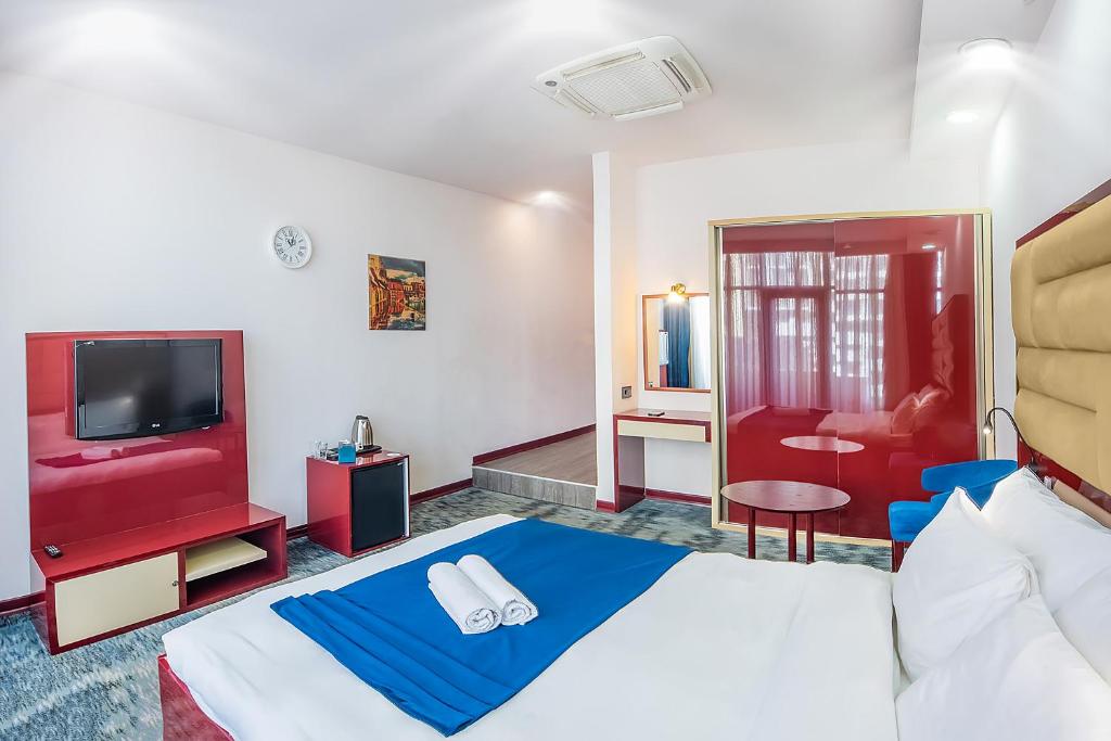 Postel nebo postele na pokoji v ubytování Denis hotel