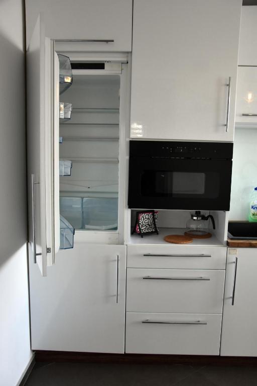 Kuchyň nebo kuchyňský kout v ubytování Apartament Night Premium Krakow