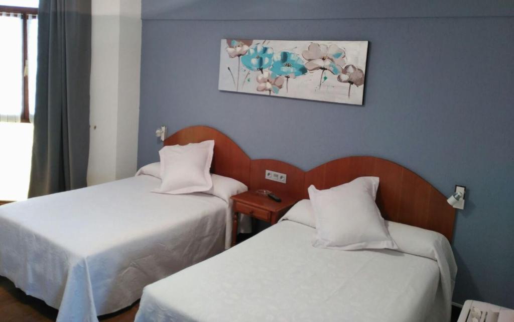 Postel nebo postele na pokoji v ubytování Hotel Urgaín