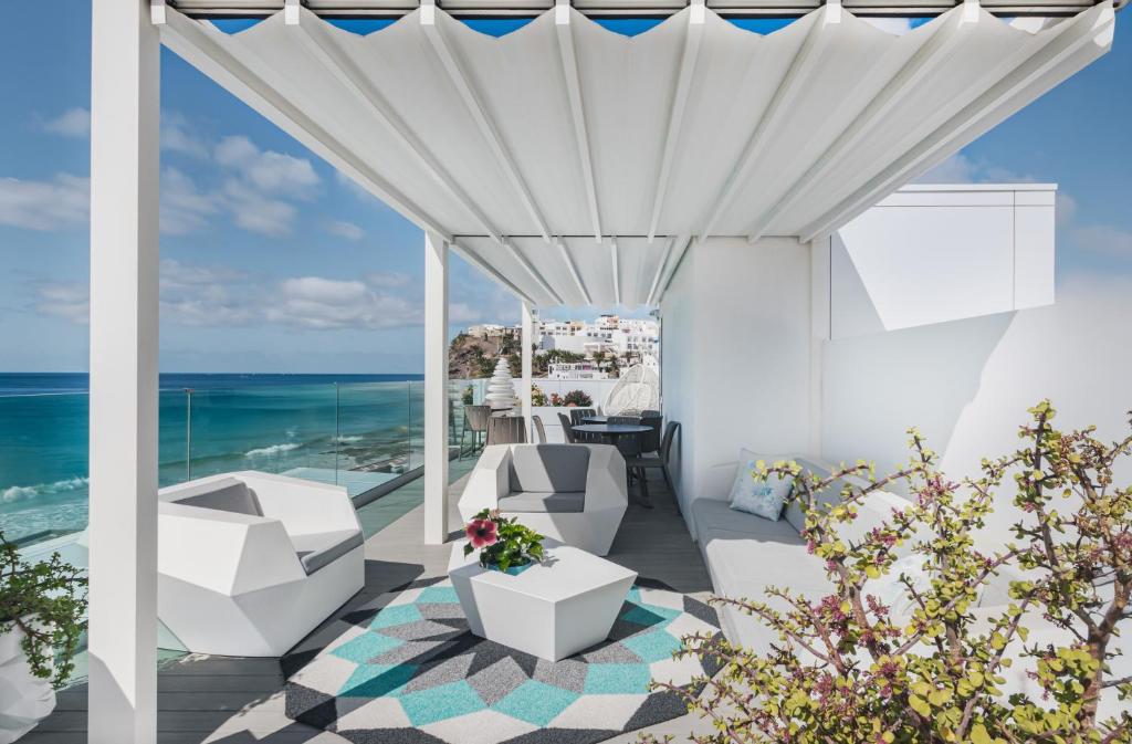 a patio with a view of the ocean at RichMood Apartments - PARADISE Apartment in Morro del Jable