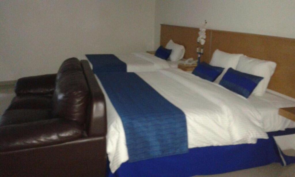 Postel nebo postele na pokoji v ubytování Hotel CEO