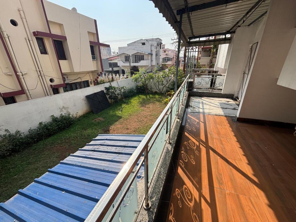 an empty balcony of a building with a railing at Gupta Residence. in Dhanbād