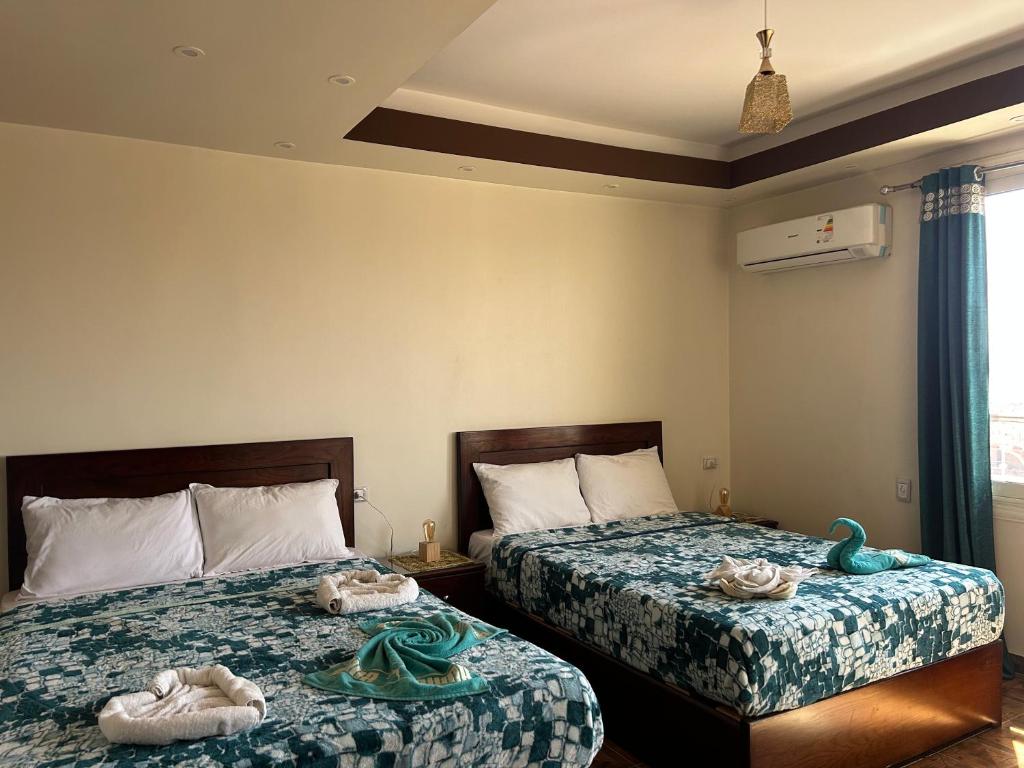 Postel nebo postele na pokoji v ubytování Giza Pyramids View Guest house