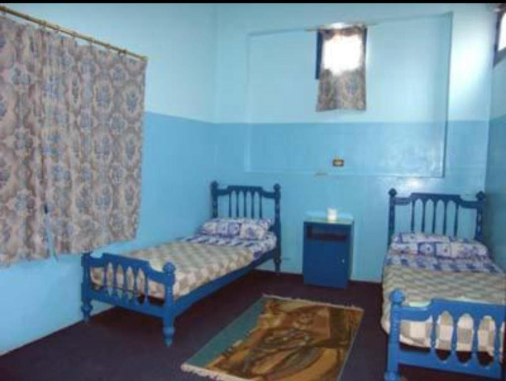 Postel nebo postele na pokoji v ubytování Oasis hotel