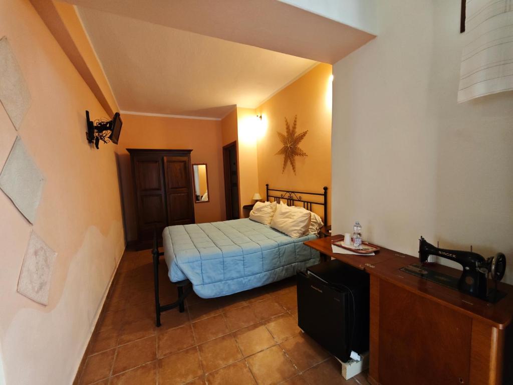 Postel nebo postele na pokoji v ubytování B&B Domu Delunas