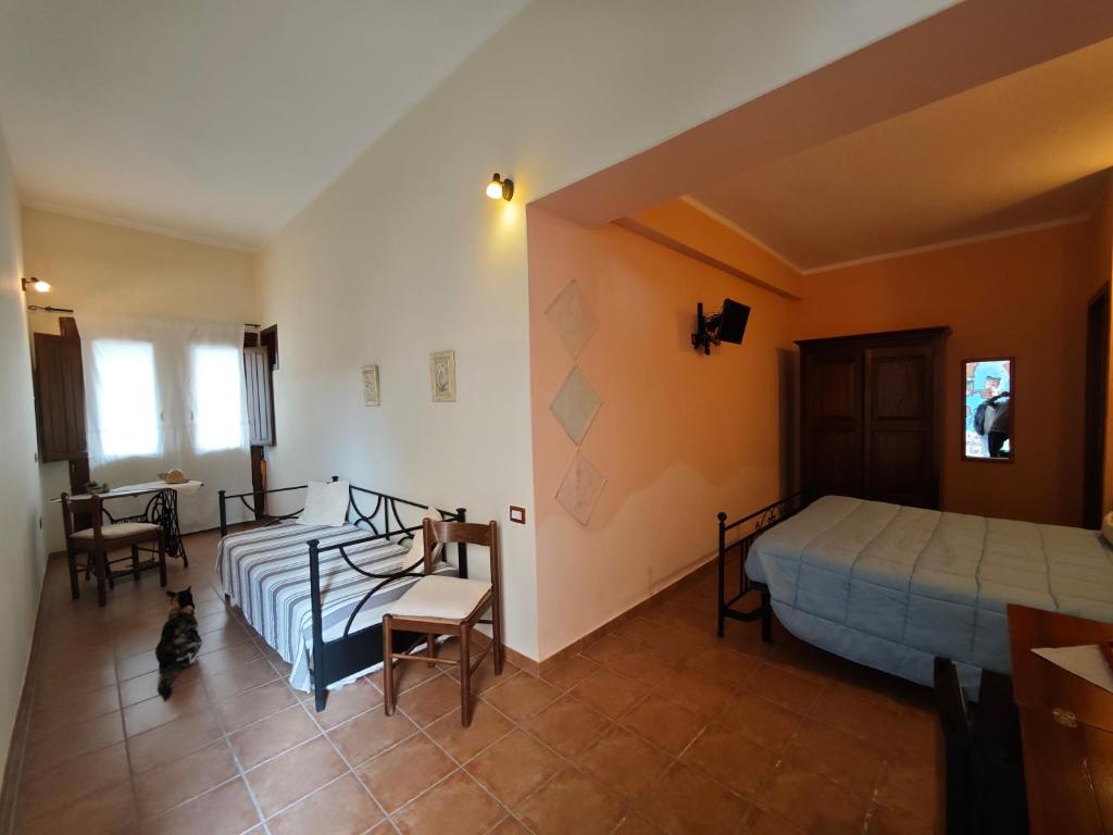 Postel nebo postele na pokoji v ubytování B&B Domu Delunas