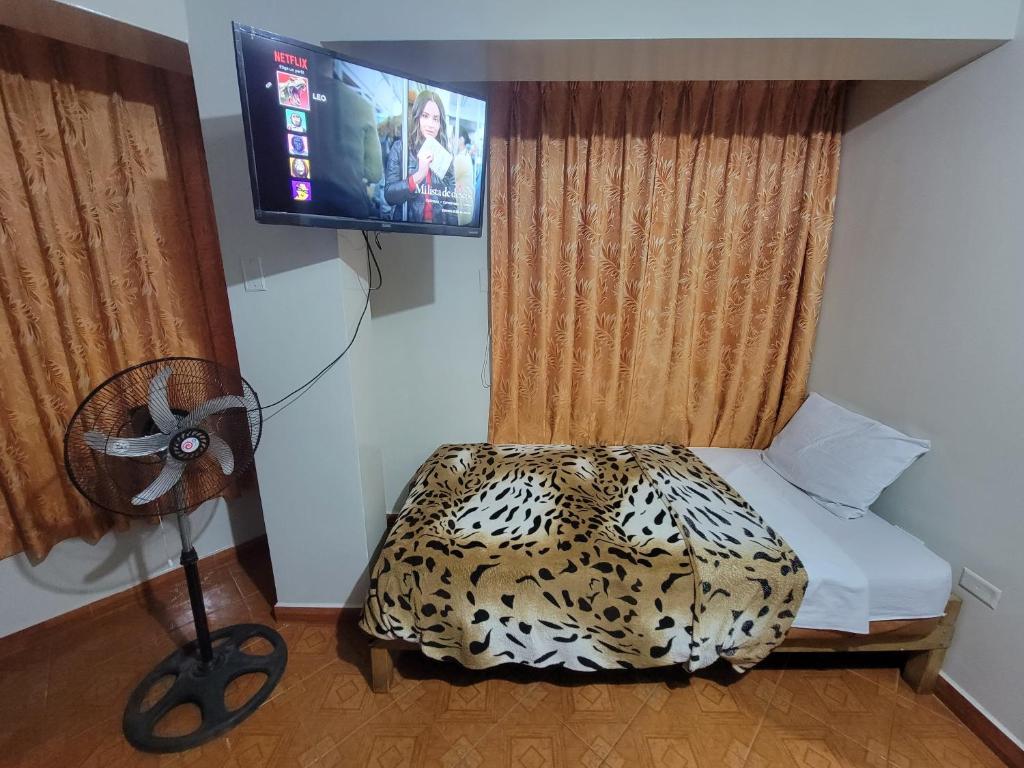 Postel nebo postele na pokoji v ubytování Hospedaje Leo