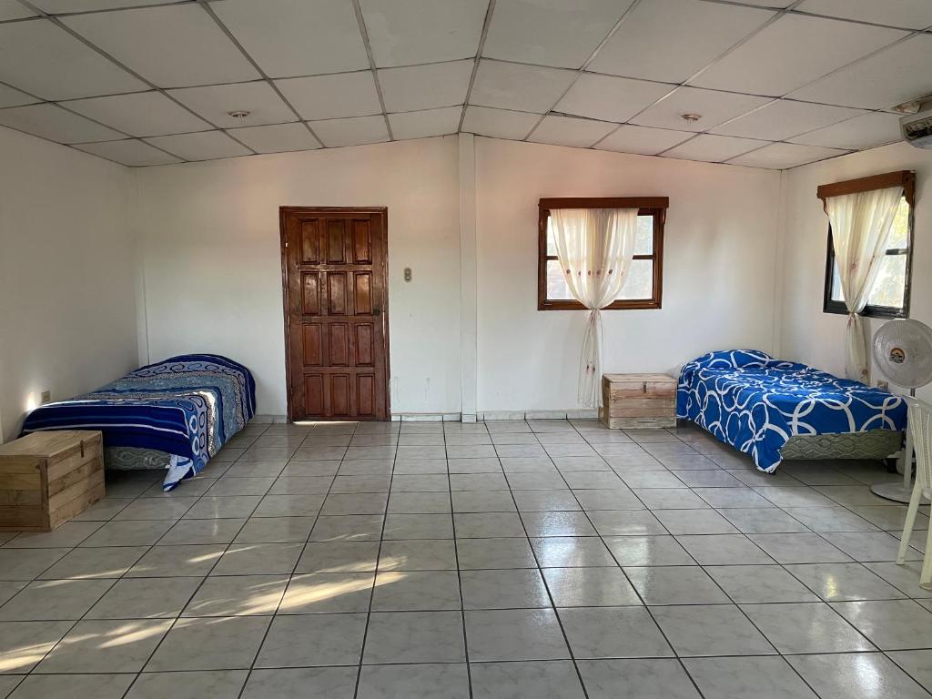 Postel nebo postele na pokoji v ubytování Managua Hotel Oasis