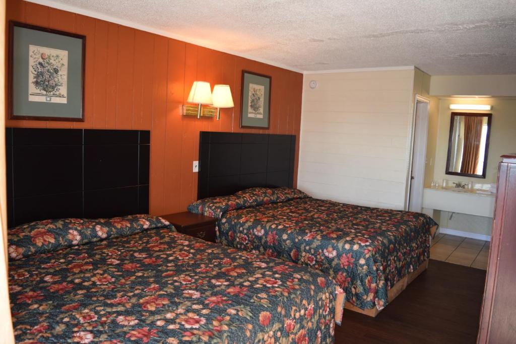 Postel nebo postele na pokoji v ubytování Dry Dock Motel