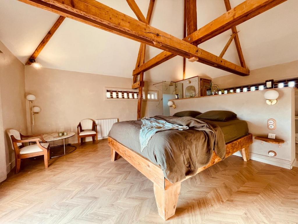 Postel nebo postele na pokoji v ubytování Évasion nature et bien-être - SPA - Petit Déjeuner