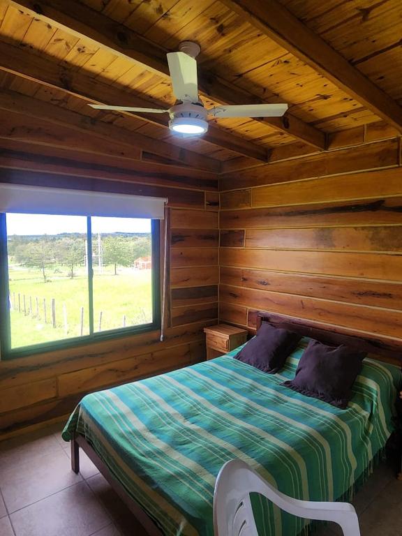 Postel nebo postele na pokoji v ubytování Cabaña Altos los Reartes