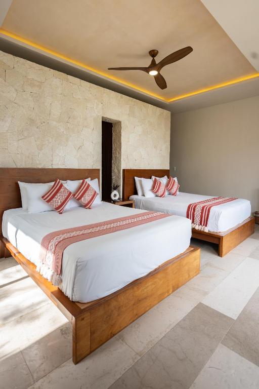 Postel nebo postele na pokoji v ubytování Khaban Bacalar Hotel Boutique