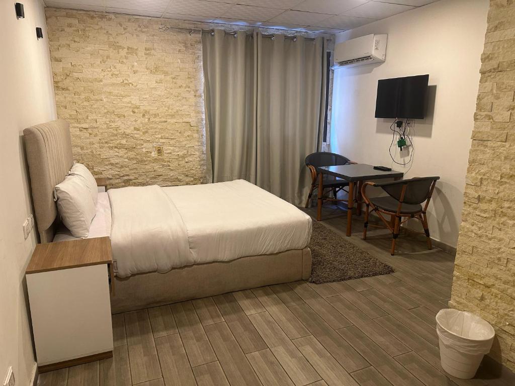 TV a/nebo společenská místnost v ubytování cairo jordan hotel