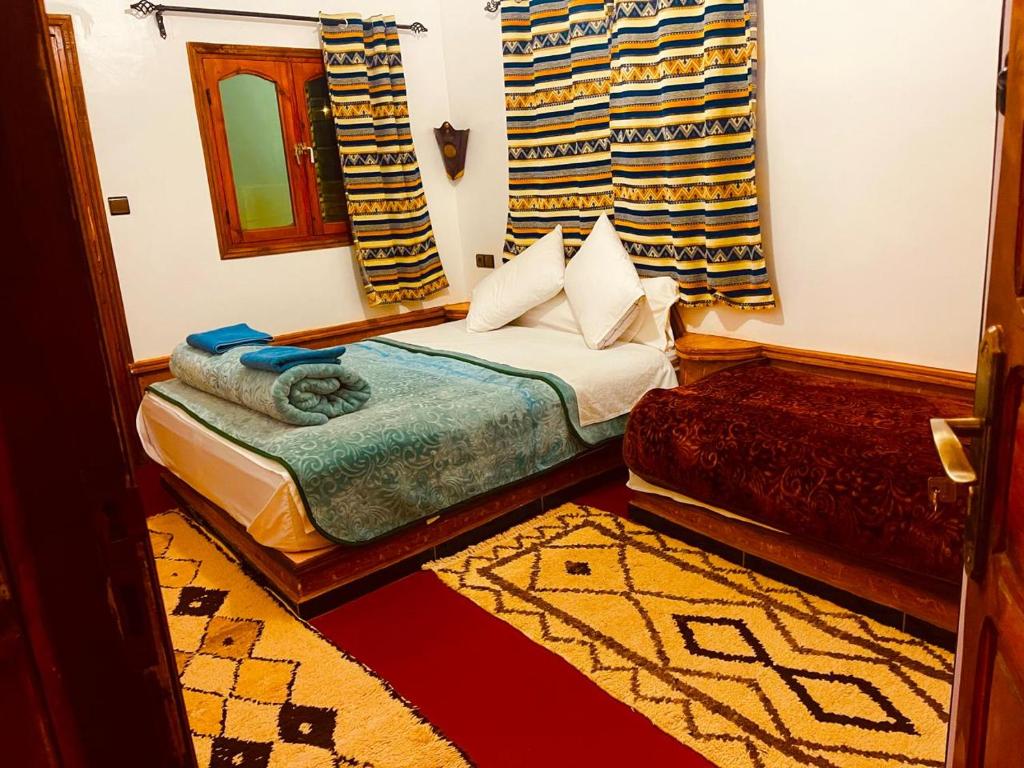Postel nebo postele na pokoji v ubytování Auberge la belle vue dades