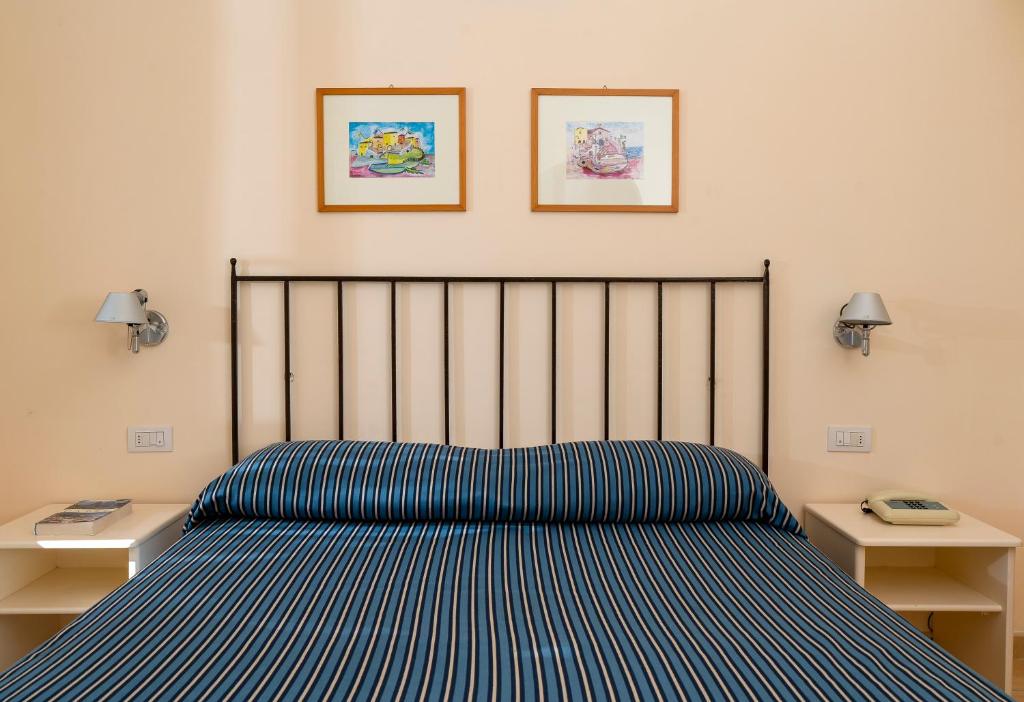 Postel nebo postele na pokoji v ubytování Hotel Senaria