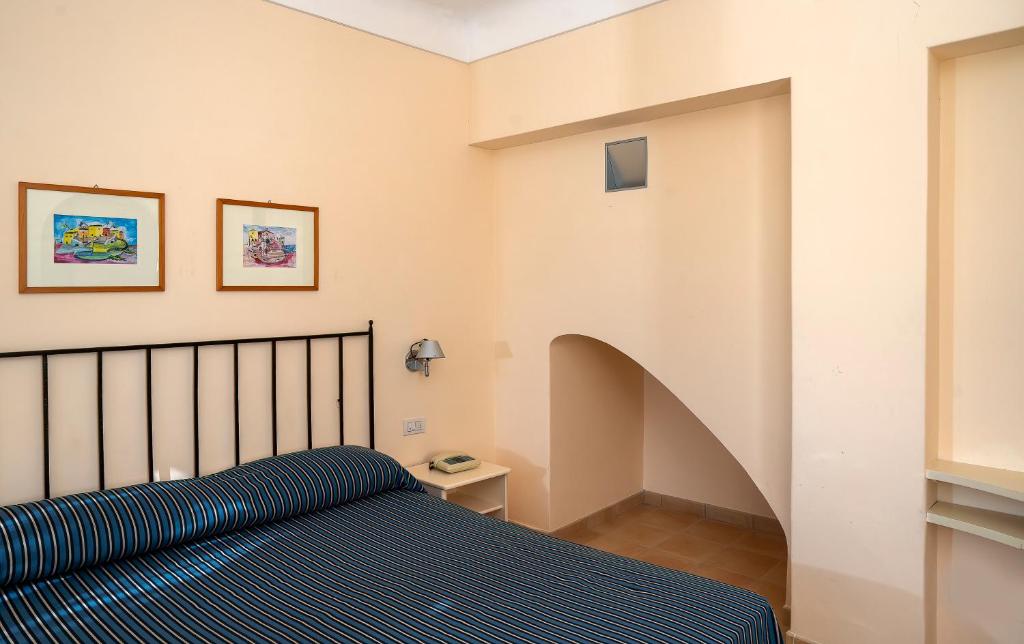 Postel nebo postele na pokoji v ubytování Hotel Senaria