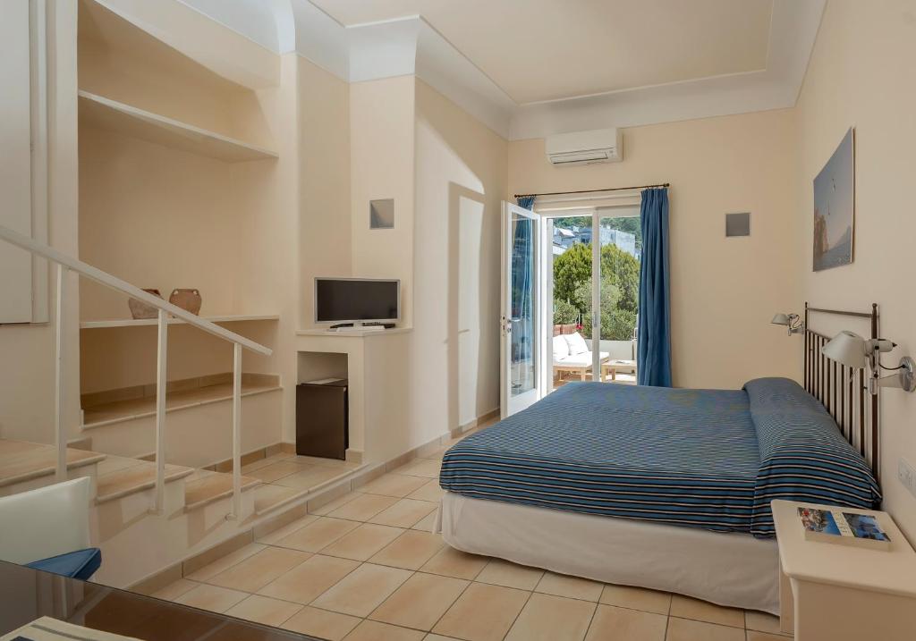 Postel nebo postele na pokoji v ubytování Hotel Senaria