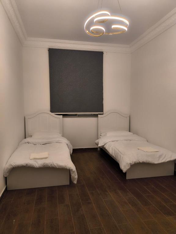 Postel nebo postele na pokoji v ubytování Aladdin guest House