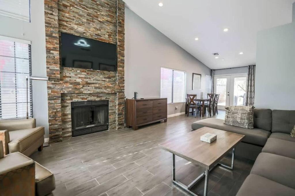 a living room with a couch and a fireplace at What you need A Hidden Gem in the Heart of Vegas in Las Vegas