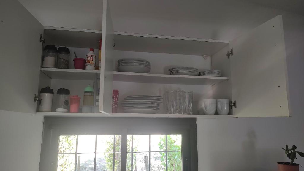 Kuchyň nebo kuchyňský kout v ubytování Cabaña las violetas