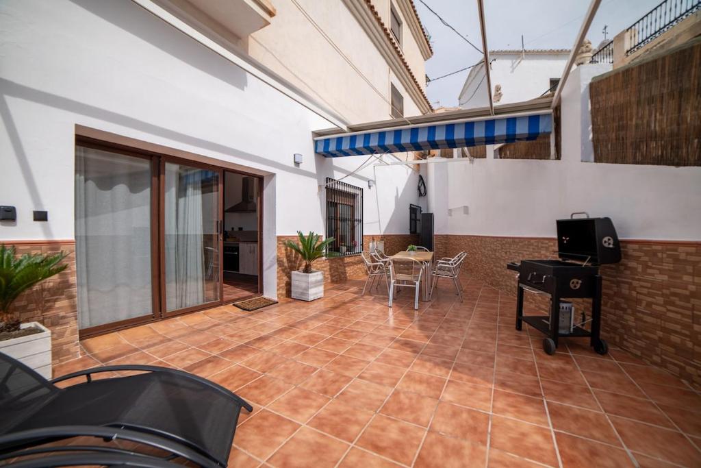 a large living room with a table and chairs at Apartamento Monte Mar 1 in Haza del Trigo