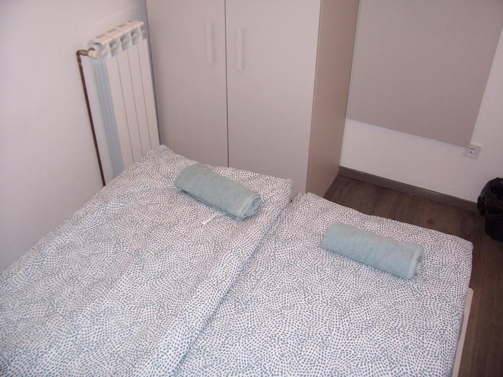 Postel nebo postele na pokoji v ubytování Trinity Apartment