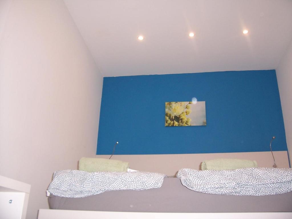 Postel nebo postele na pokoji v ubytování Trinity Apartment