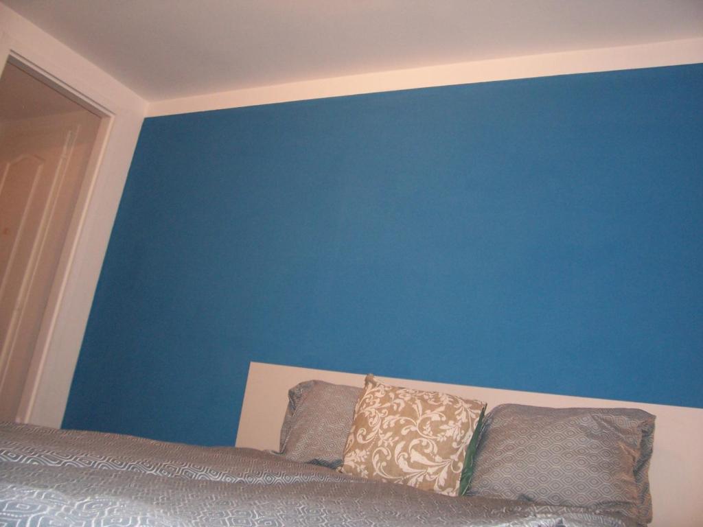 Postel nebo postele na pokoji v ubytování Trinity Apartment