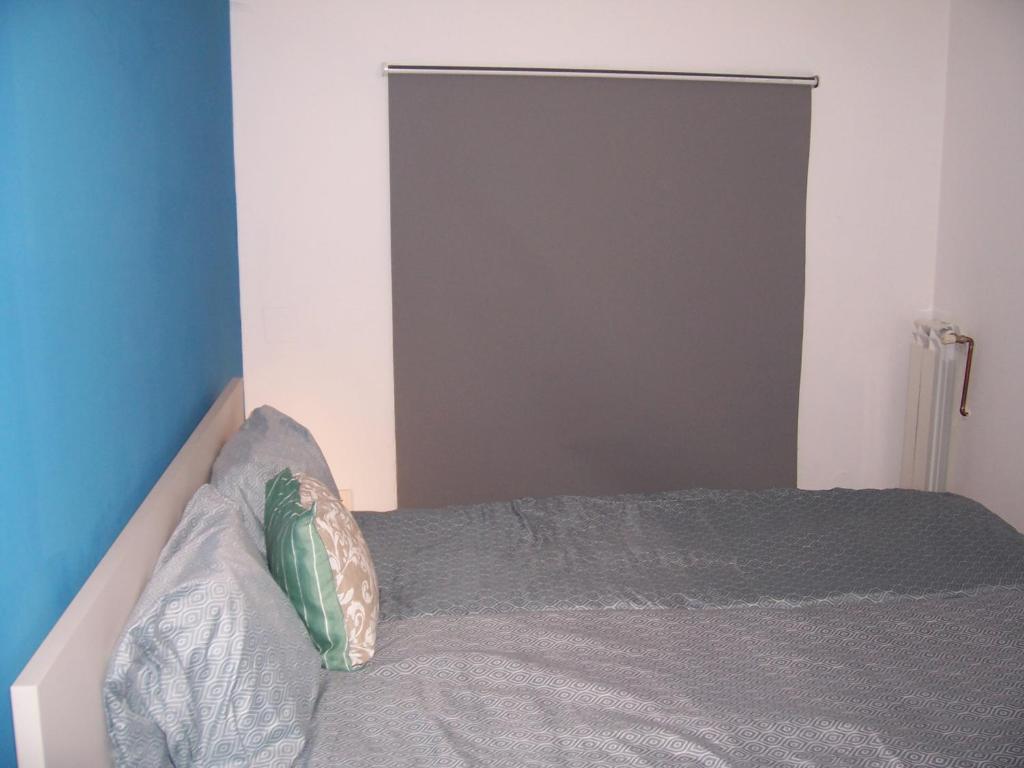 Postel nebo postele na pokoji v ubytování Trinity Apartment
