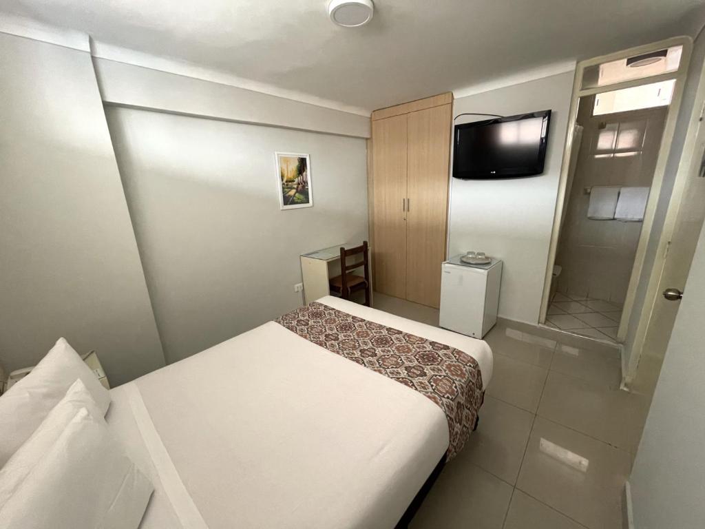 Postel nebo postele na pokoji v ubytování Hotel Premier