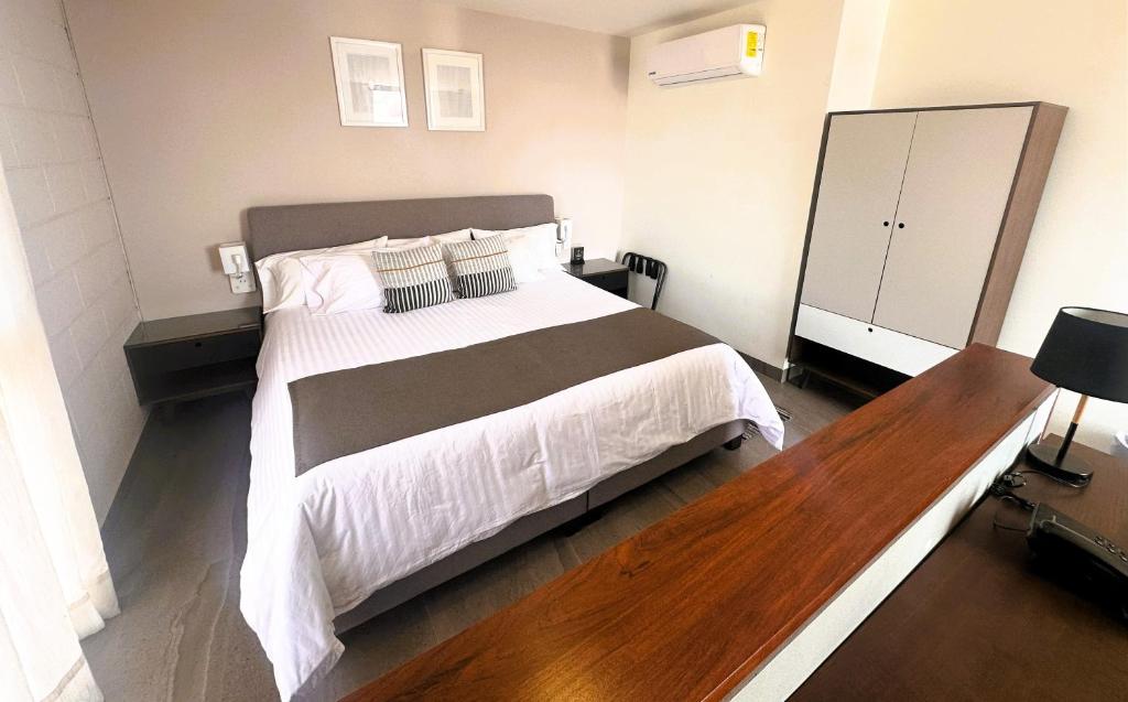 Postel nebo postele na pokoji v ubytování Arboleda 5 Luxury Lofts