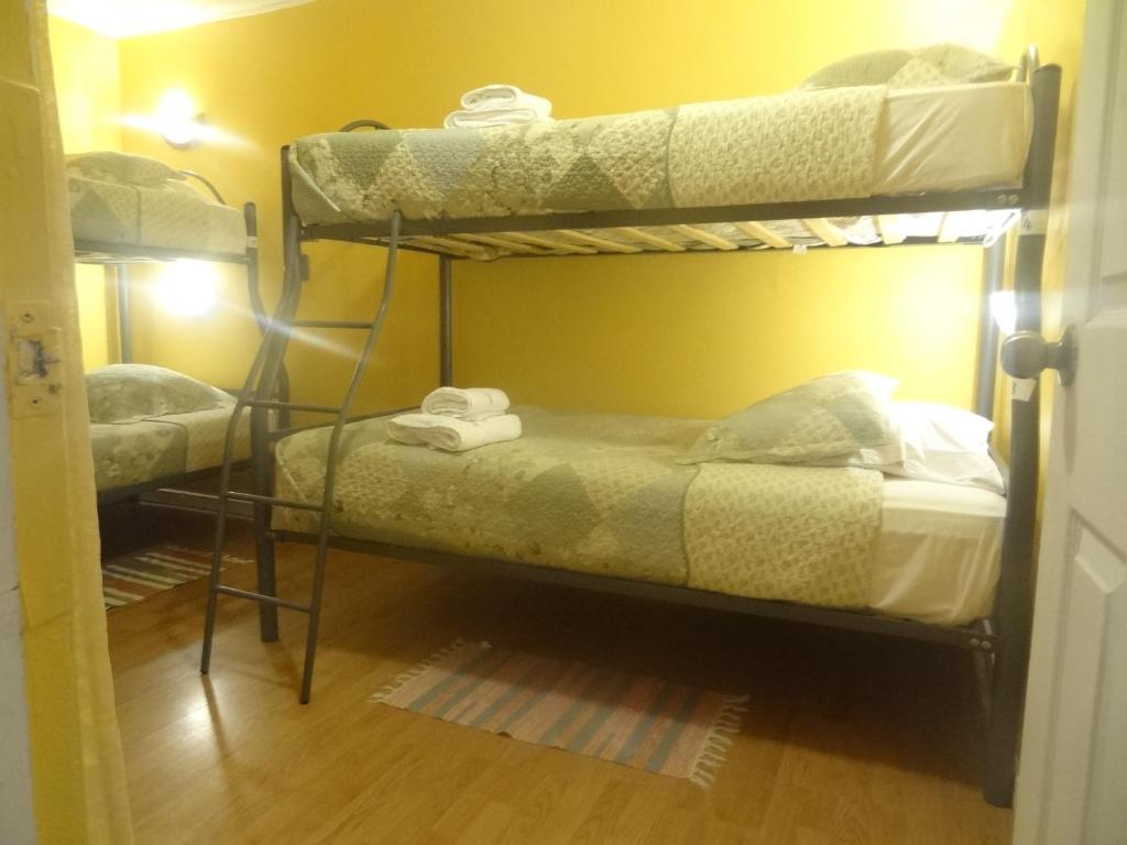 Postel nebo postele na pokoji v ubytování Hostal Kirckir