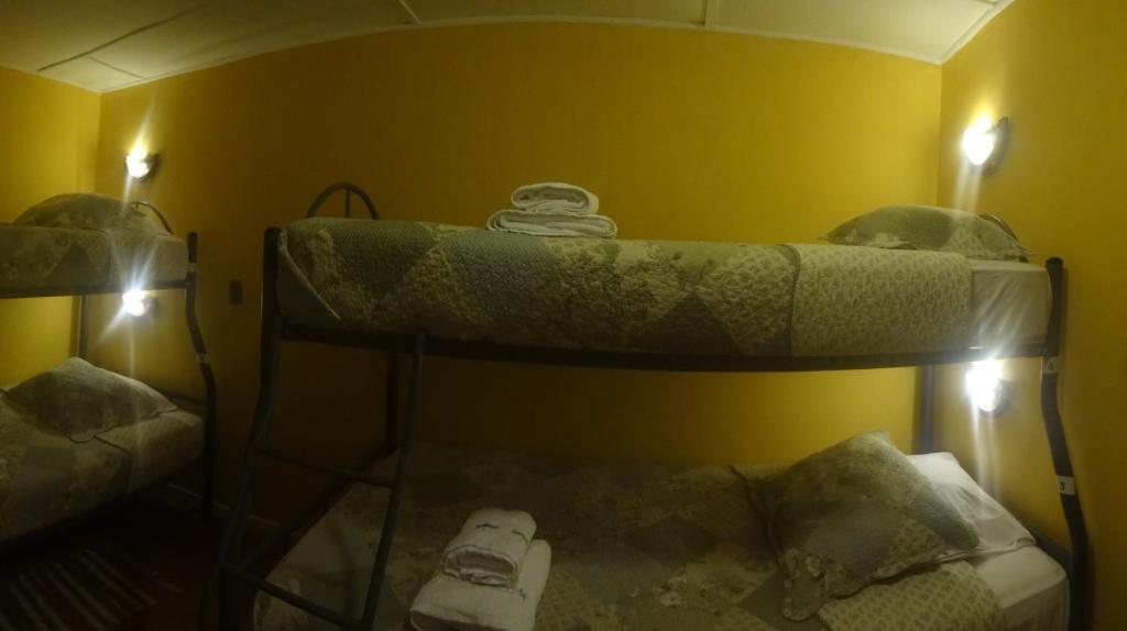 Postel nebo postele na pokoji v ubytování Hostal Kirckir