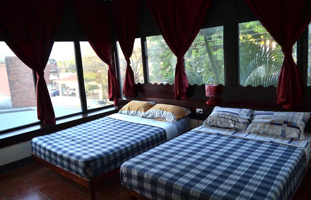 Postel nebo postele na pokoji v ubytování Hotel Columbus