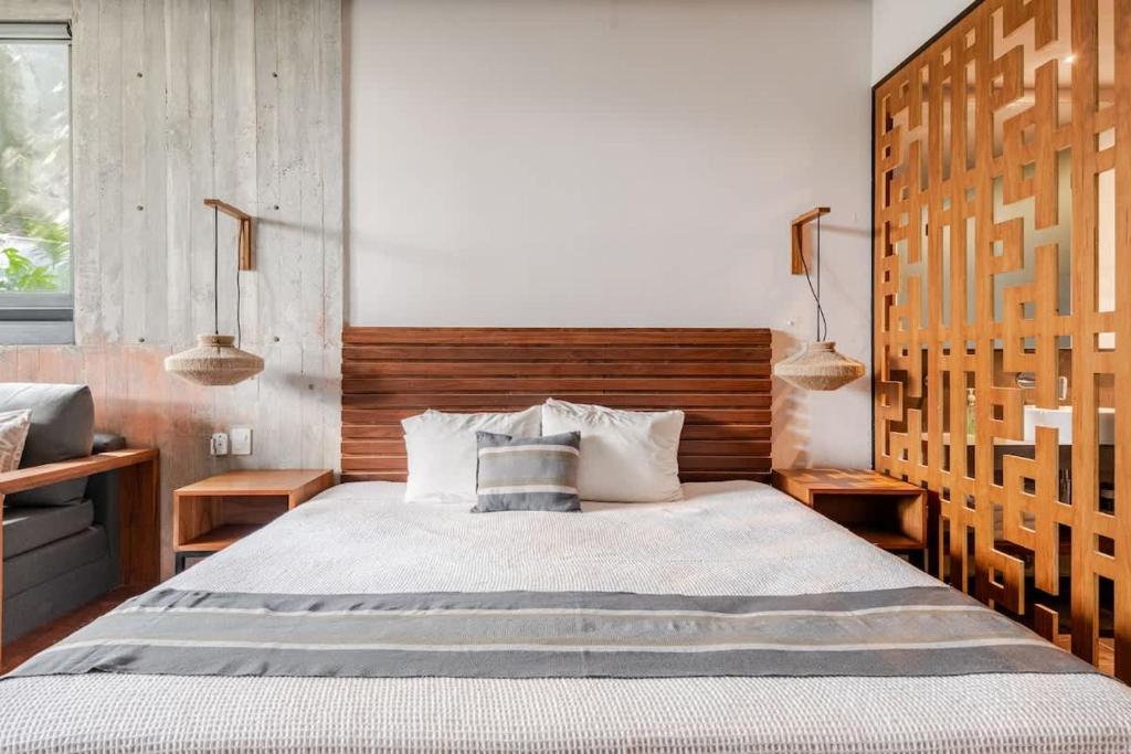 Ένα ή περισσότερα κρεβάτια σε δωμάτιο στο Estudio en Av. Cobá para 4 personas