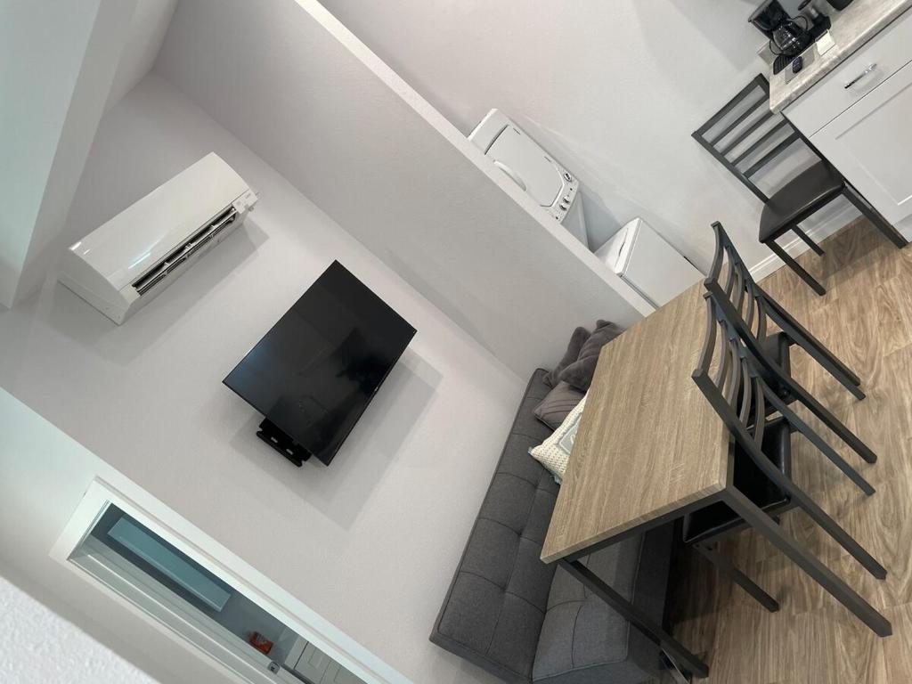 an overhead view of a living room with a table and a television at Modern 1-bedroom Studio with Kitchen and Laundry in Santa Clarita