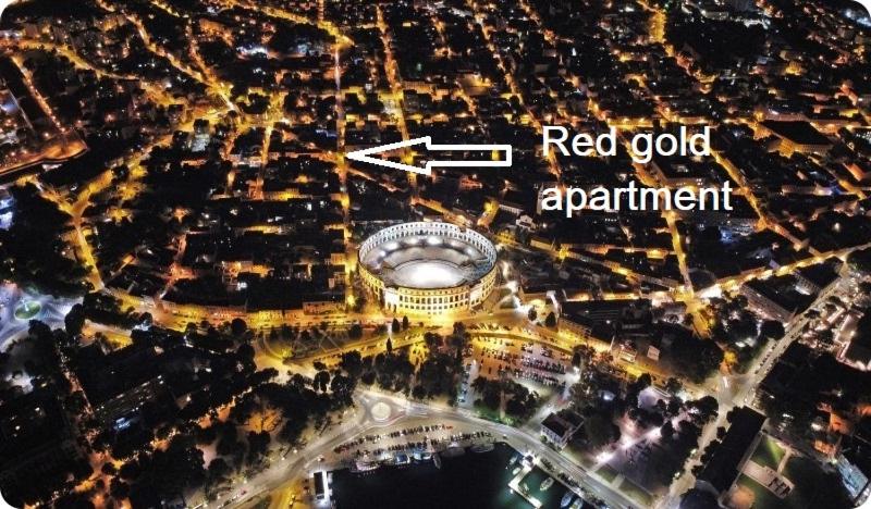 an aerial view of a city at night with a red gold apartment at Red gold apartment in Pula