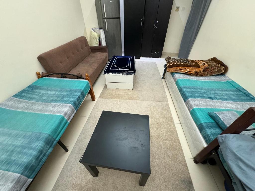 Postel nebo postele na pokoji v ubytování سكن شباب بالتعاون - ALEX Hostel - Sharjah