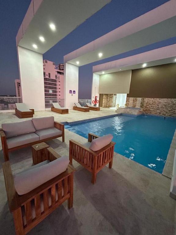 Bazén v ubytování Apartamento Magno Loft Bocagrande nebo v jeho okolí